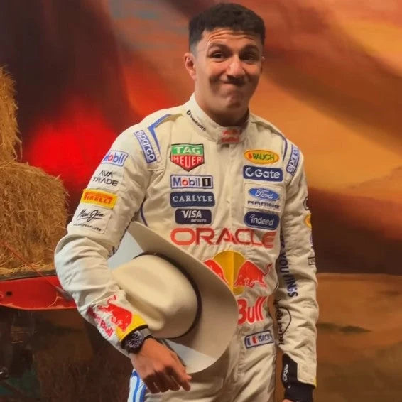 2026 Red Bull F1 white race suit with blue accents and racing graphics in a United States Grand Prix inspired promotional scene