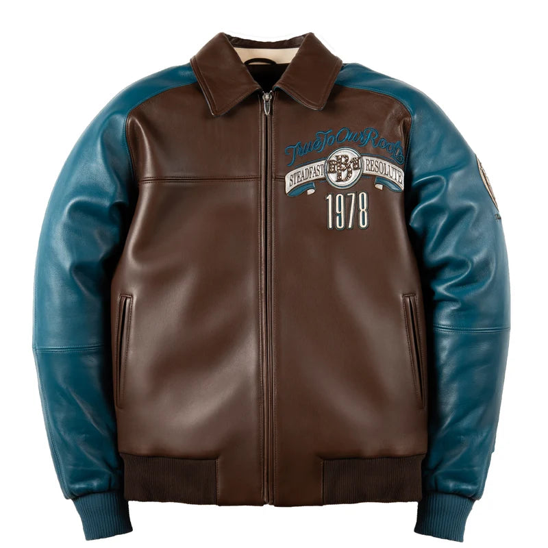 Front view of the Pelle Pelle True To Our Roots brown jacket with teal sleeves, embroidered chest crest, 1978 lettering, and front zipper