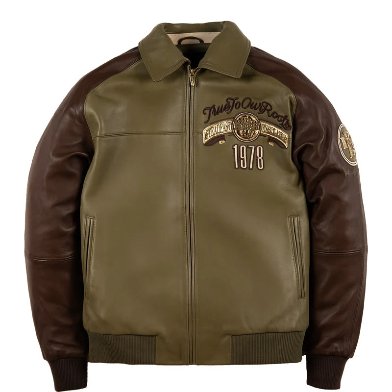 Front view of the Pelle Pelle True To Our Roots olive green jacket with brown sleeves, decorative chest crest, 1978 artwork, and front zipper