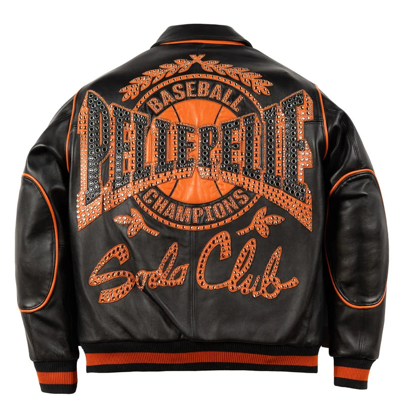 Back view of black Champions-style jacket featuring oversized orange and black studded graphics and Soda Club lettering