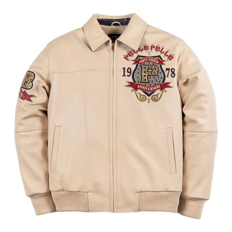  Front view of the Pelle Pelle Unrivaled Anniversary ivory jacket with chest crest, red accents, full-length zipper, and ribbed cuffs