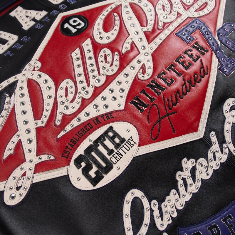 Close-up of the Pelle Pelle jacket's studded lettering and contrasting decorative graphic panels.