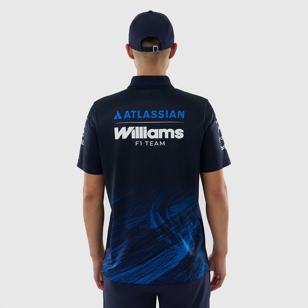 Person wearing a dark blue polo shirt with 'Atlassian Williams F1 Team' branding on the back.