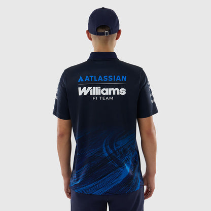Person wearing a dark blue polo shirt with 'Atlassian Williams F1 Team' branding on the back.