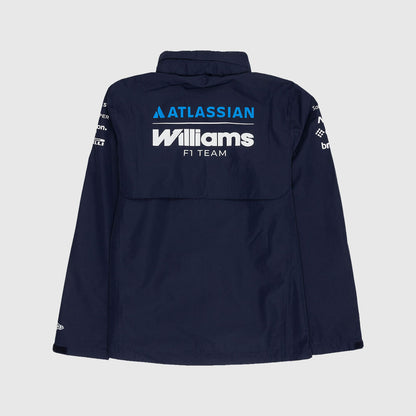 A navy blue long-sleeve jacket shown from the back, featuring 'ATLASSIAN Williams F1 TEAM' printed in white and blue on the upper back, with sponsor logos on the sleeves, set against a light gray background.
