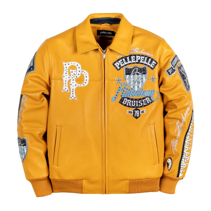 Model wearing a yellow Pelle Pelle American Bruiser graphic jacket with decorative patches and contrasting streetwear details