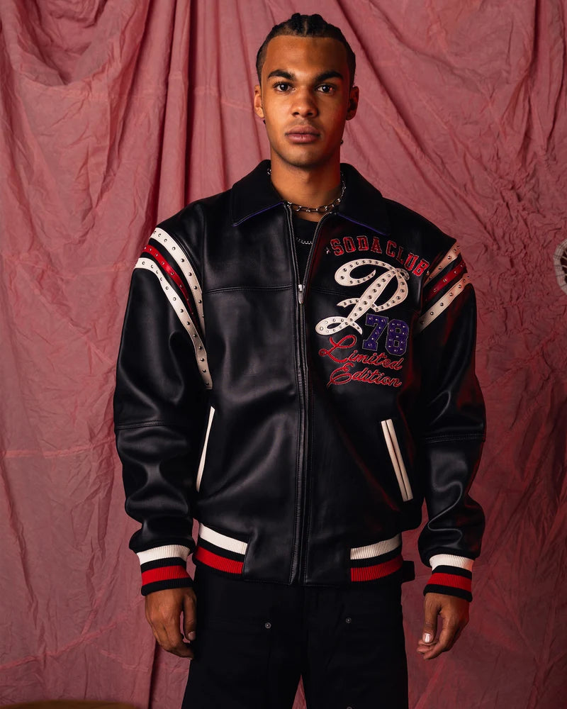  Close-up of the Pelle Pelle jacket's studded lettering and contrasting decorative graphic panels.