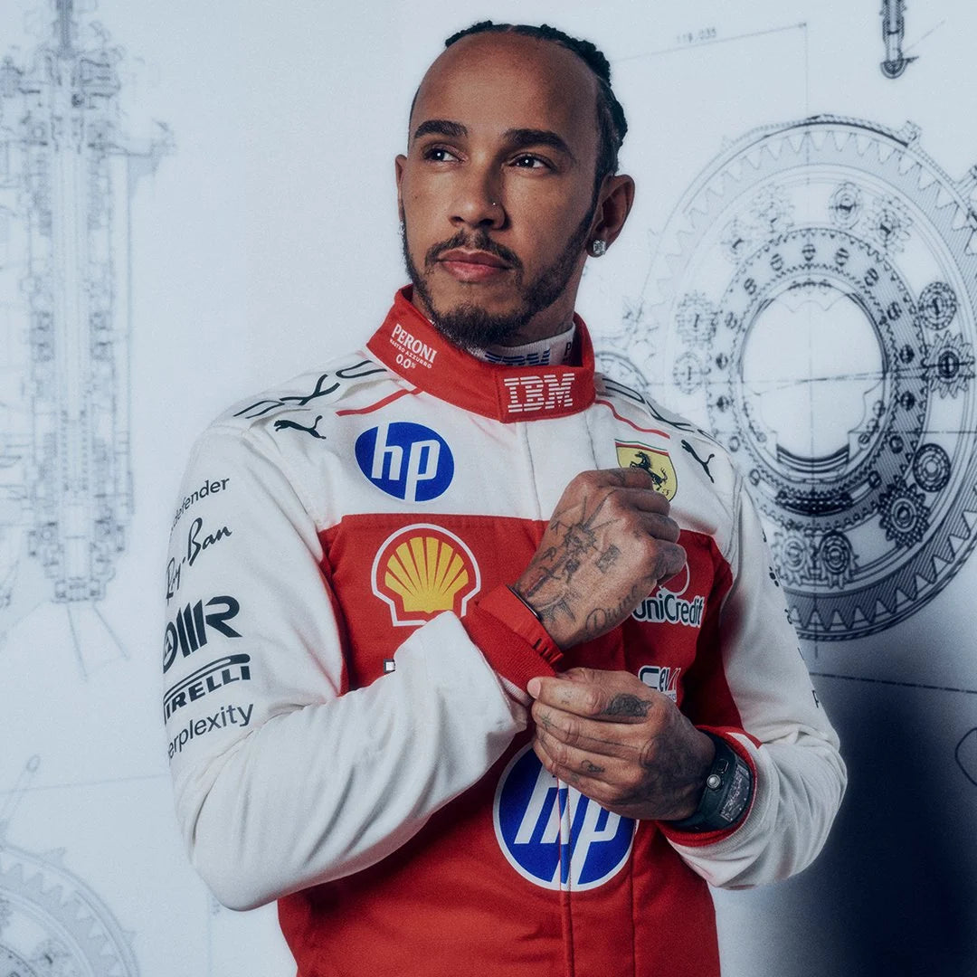 Close-up of a red and white Ferrari-inspired F1 racing suit with sponsor-style graphics and blue accents