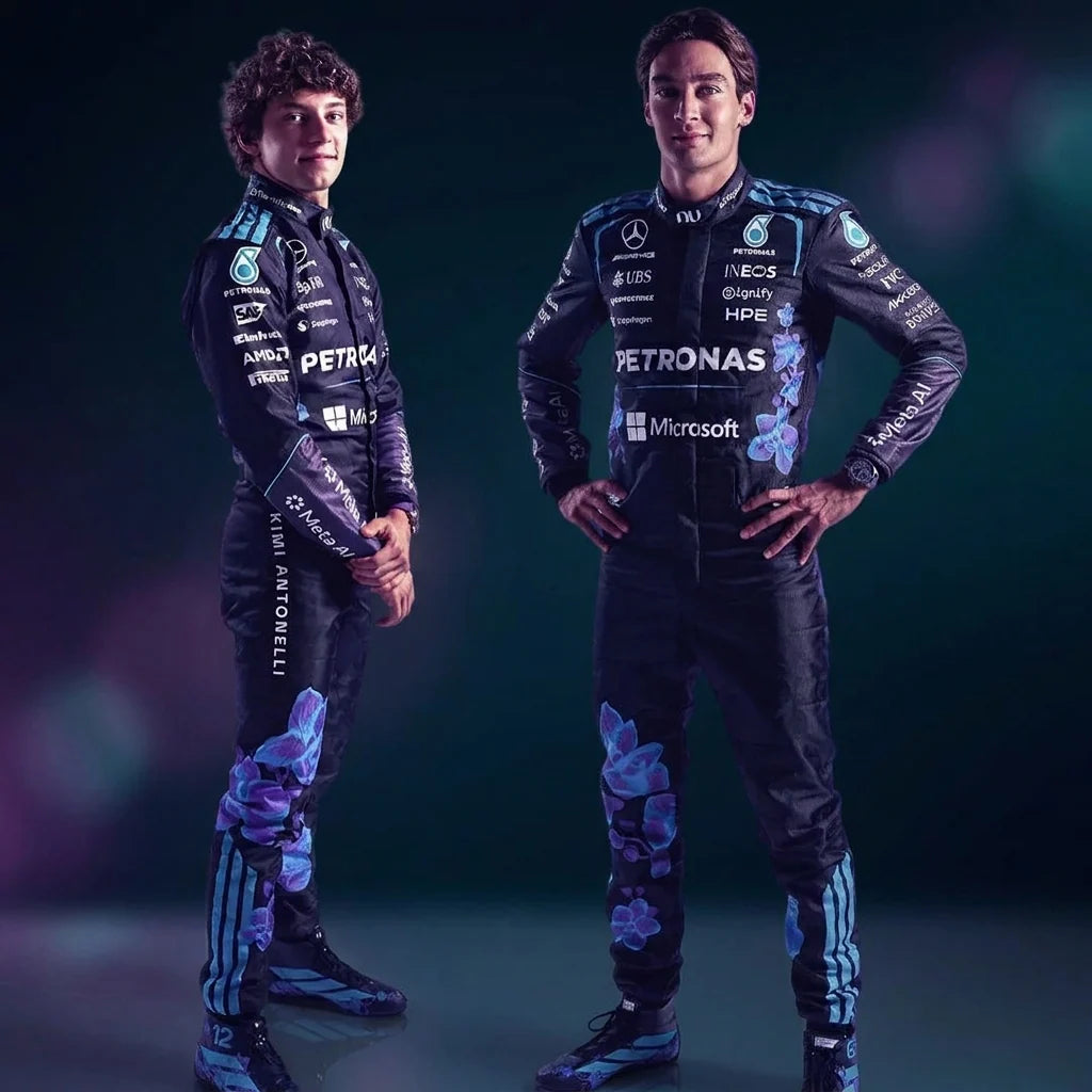 Two drivers wearing dark Mercedes-inspired racing suits with teal stripes and purple floral graphics