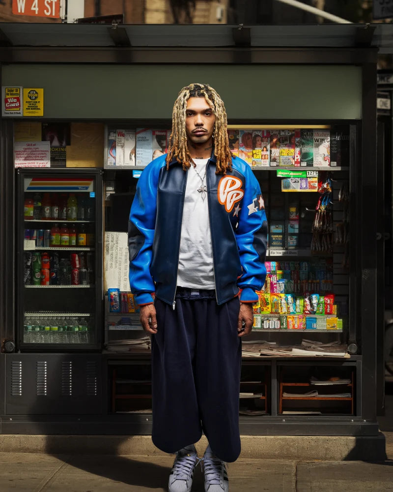 Front view of the Pelle Pelle Classic Soda Club jacket styled with a white T-shirt and relaxed-fit pants.