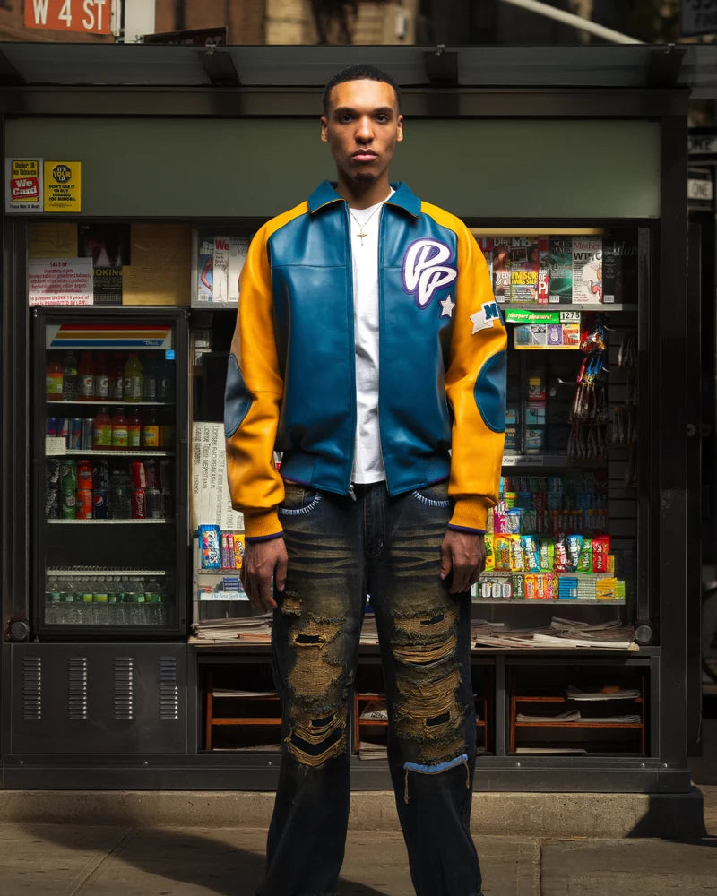Model wearing a teal blue and mustard yellow Pelle Pelle Classic Soda Club Plush Jacket with a PP chest emblem and contrasting sleeves