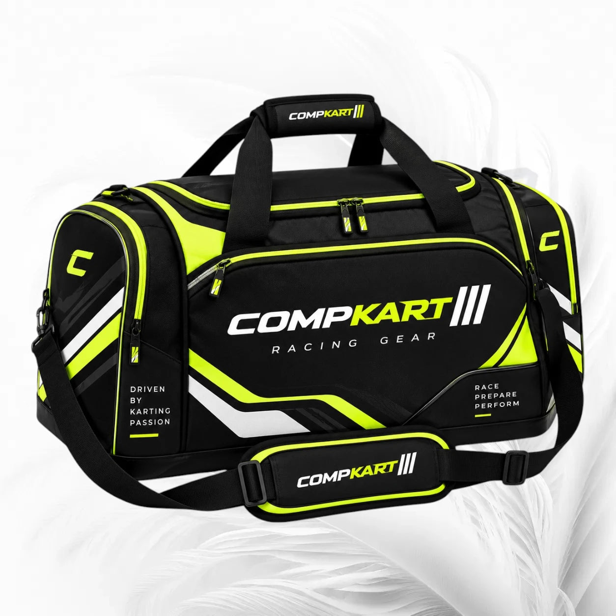 Black and neon yellow CompKart racing duffel bag with white and yellow branding, shown on a light gray background.