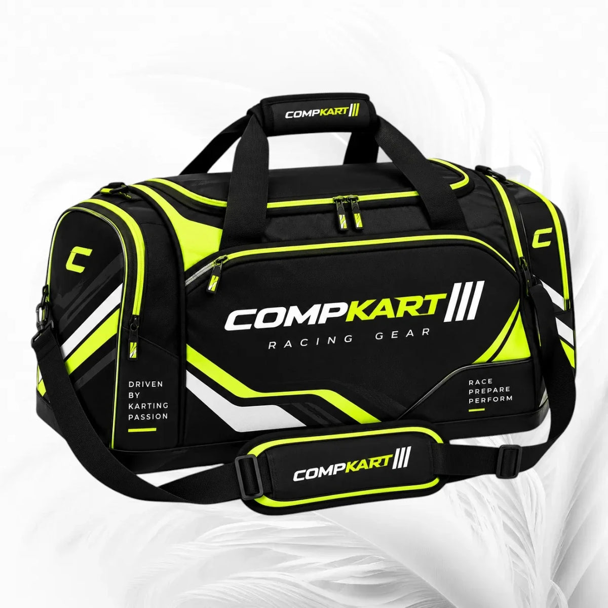 Black and neon yellow CompKart racing duffel bag with white and yellow branding, shown on a light gray background.
