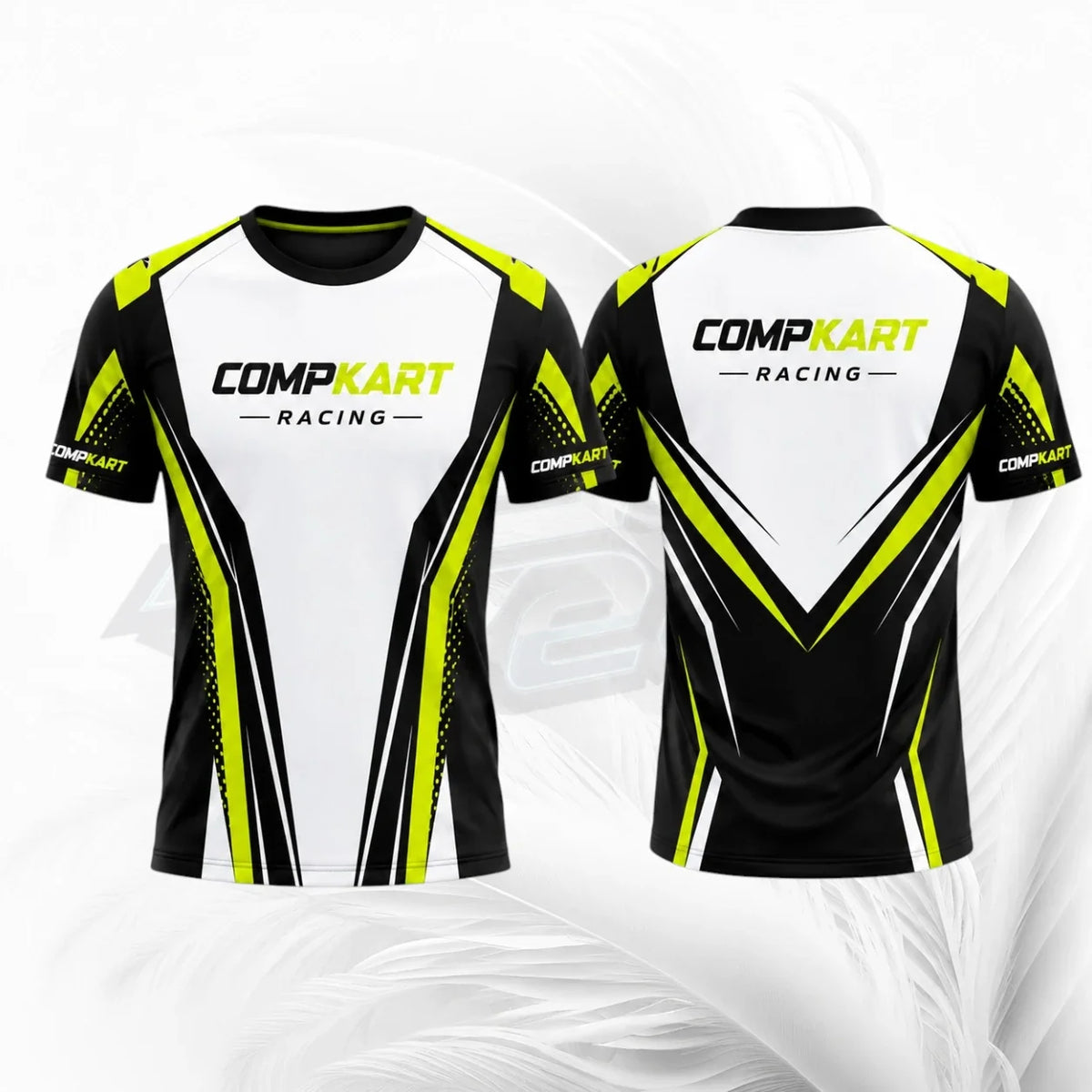 Front and back views of a short-sleeve athletic jersey with a white, black, and neon yellow design. The front features the text 'COMPKART RACING' across the chest, and the back features a large V-shaped graphic with the same branding.